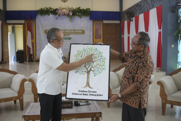 Mubariq Accepting Award from Sintang Government